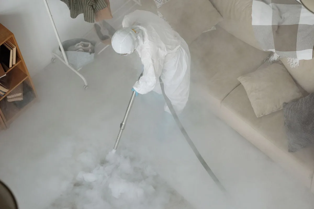Biohazard cleanup technician in protective equipment, Coleraine, MN